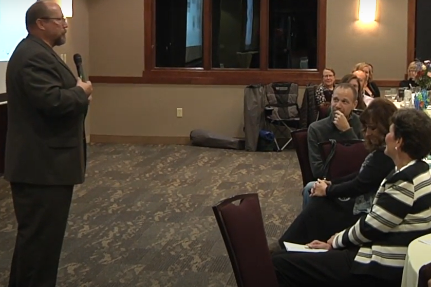 Mike speaking at event